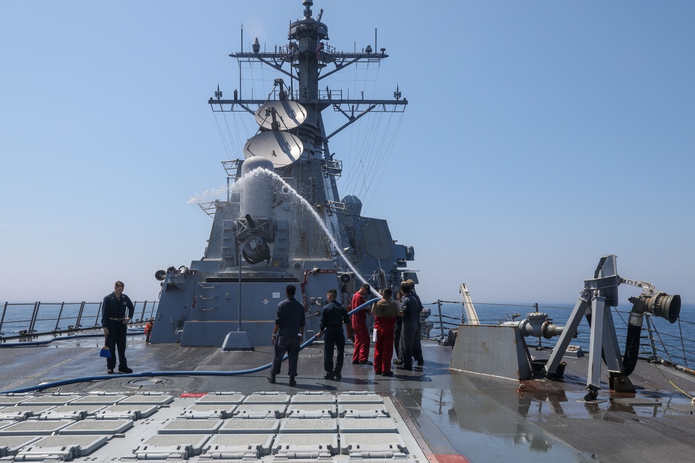 Sailors aboard the USS Howard conduct a freshwater washdown in Sagami Wan