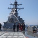 Sailors aboard the USS Howard conduct a freshwater washdown in Sagami Wan