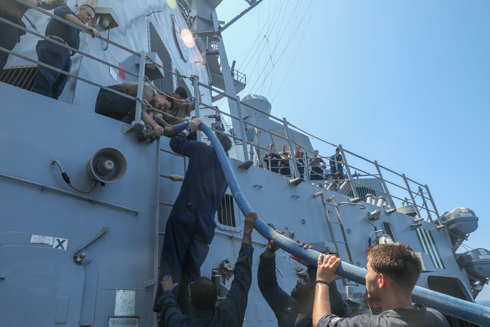 Sailors aboard the USS Howard conduct a freshwater washdown in Sagami Wan