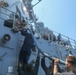 Sailors aboard the USS Howard conduct a freshwater washdown in Sagami Wan