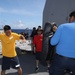Sailors aboard the USS Howard conduct a sea contamination exercise in the Philippine Sea