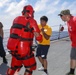 Sailors aboard the USS Howard conduct a sea contamination exercise in the Philippine Sea