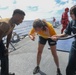 Sailors aboard the USS Howard conduct a sea contamination exercise in the Philippine Sea