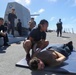 Sailors aboard the USS Howard conduct a sea contamination exercise in the Philippine Sea
