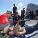 Sailors aboard the USS Howard conduct a sea contamination exercise in the Philippine Sea