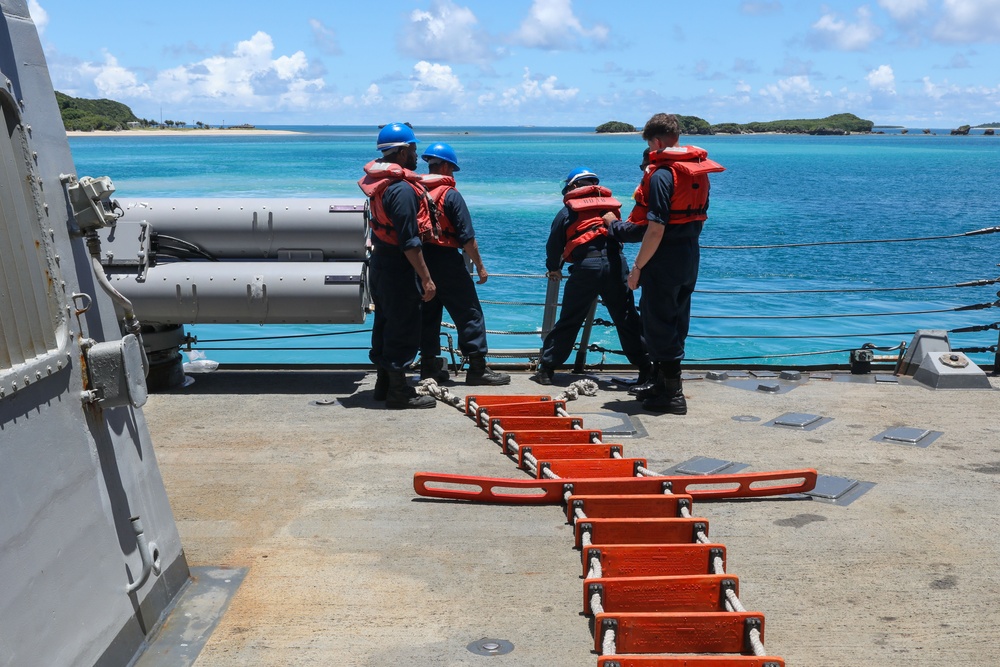 Sailors aboard the USS Howard conduct a sea and anchor detail in Okinawa, Japan