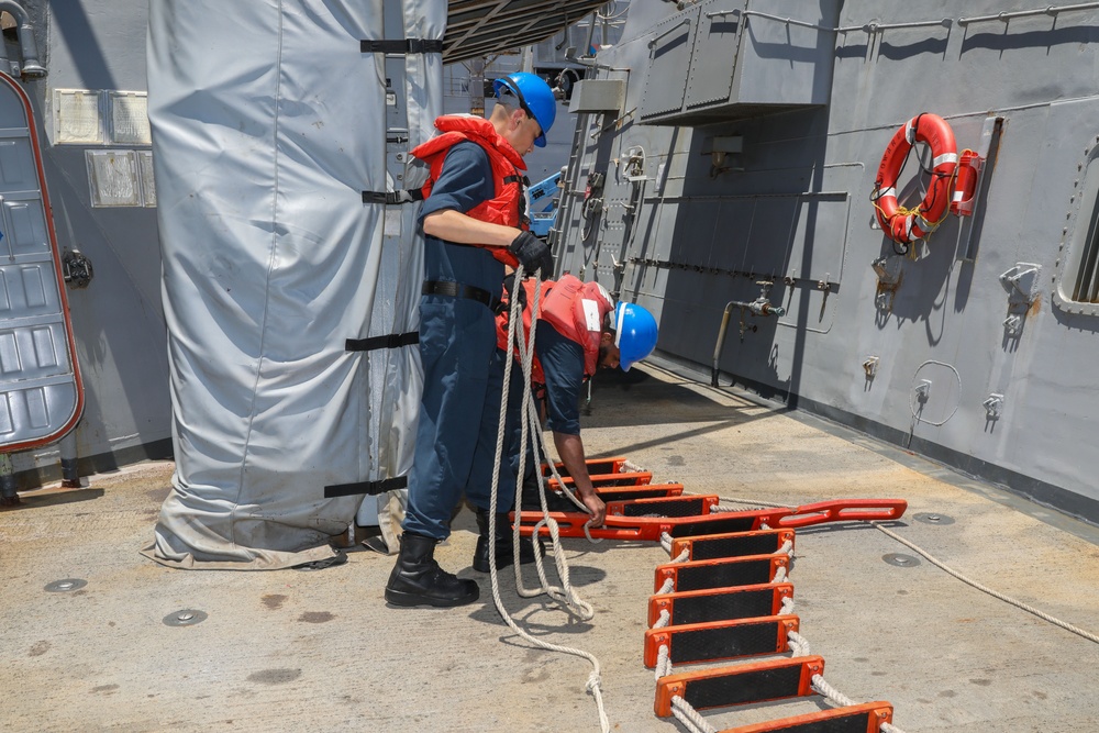 Sailors aboard the USS Howard conduct a sea and anchor detail in Okinawa, Japan