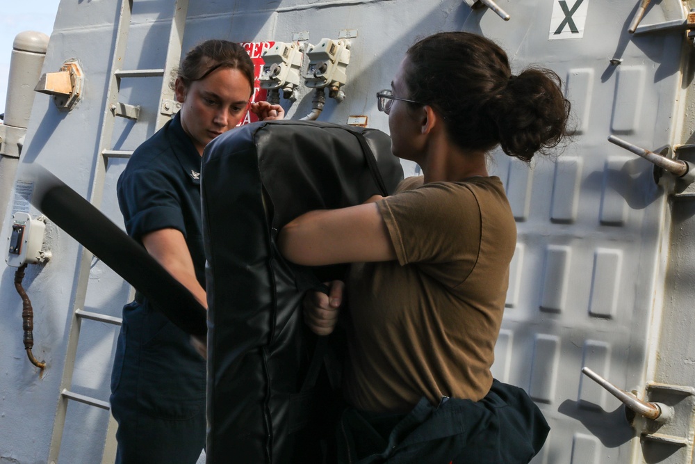 Sailors aboard the USS Howard conduct a security reaction force class in the Philippine Sea