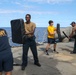 Sailors aboard the USS Howard conduct a security reaction force class in the Philippine Sea