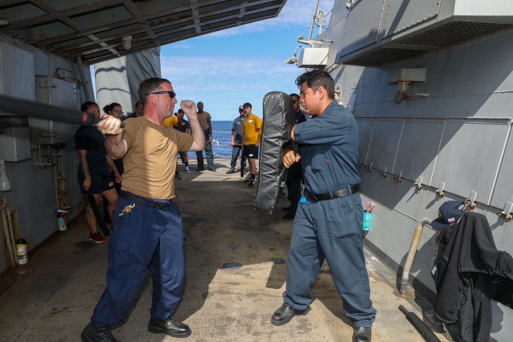 Sailors aboard the USS Howard conduct a security reaction force class in the Philippine Sea
