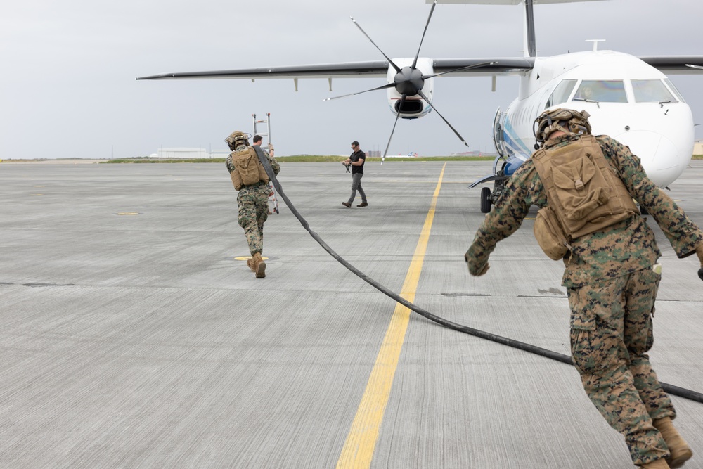 MWSS-271 Marines fuel a U.S. Air Force C-146A Wolfhound as part of exercise Northern Viking 24