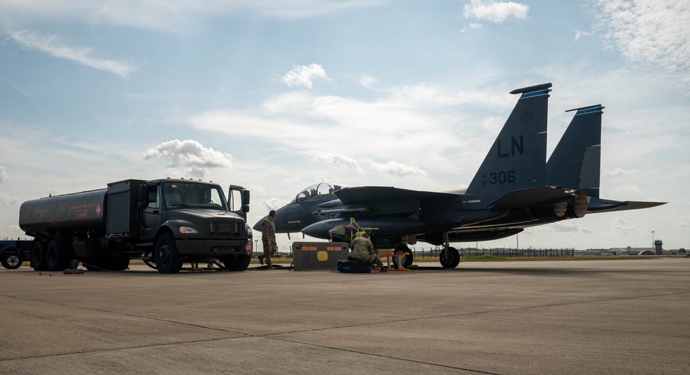 U.S. Airmen demonstrate new fueling procedures on F-15E Strike Eagles at RAF Lakenheath