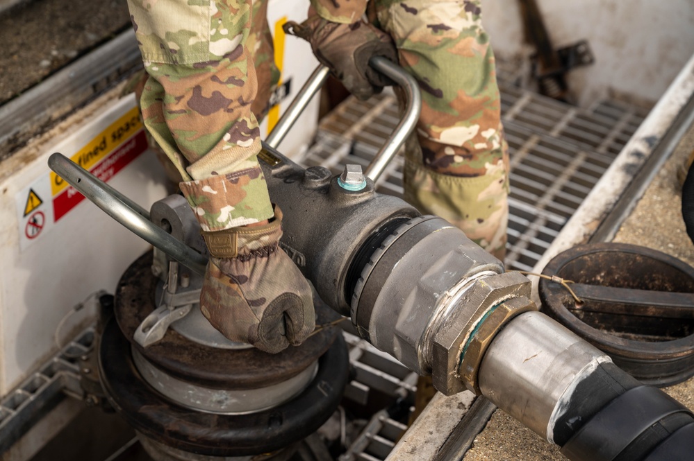 U.S. Airmen demonstrate new fueling procedures on F-15E Strike Eagles at RAF Lakenheath