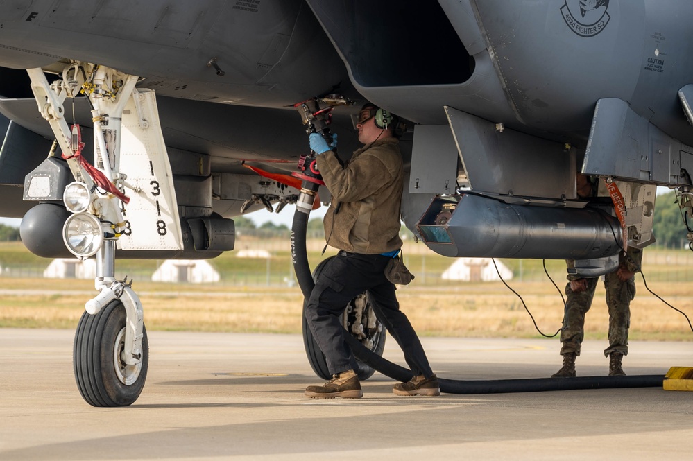 U.S. Airmen demonstrate new fueling procedures on F-15E Strike Eagles at RAF Lakenheath