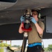 U.S. Airmen demonstrate new fueling procedures on F-15E Strike Eagles at RAF Lakenheath