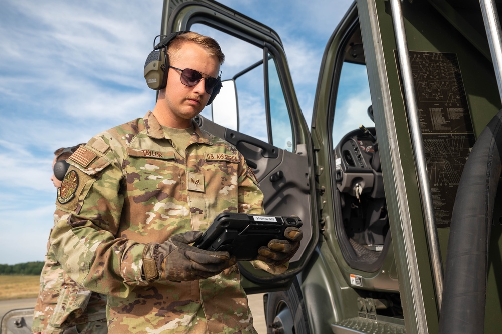 U.S. Airmen demonstrate new fueling procedures on F-15E Strike Eagles at RAF Lakenheath