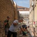 NAS Sigonella Sailors volunteer for a local school clean-up efforts.