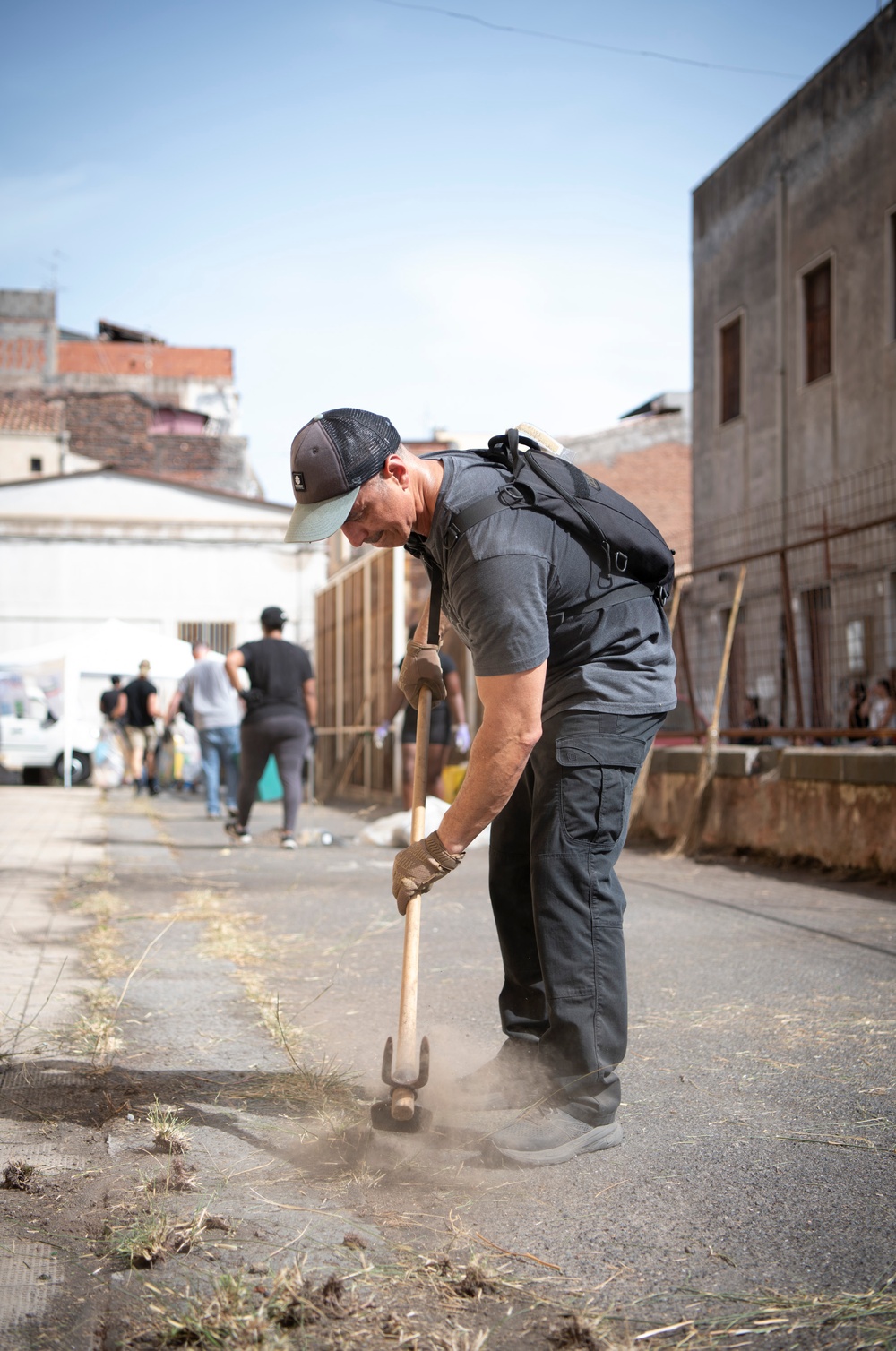 NAS Sigonella Sailors volunteer for a local school clean-up efforts.