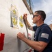 NAS Sigonella Sailors volunteer for a local school clean-up efforts.