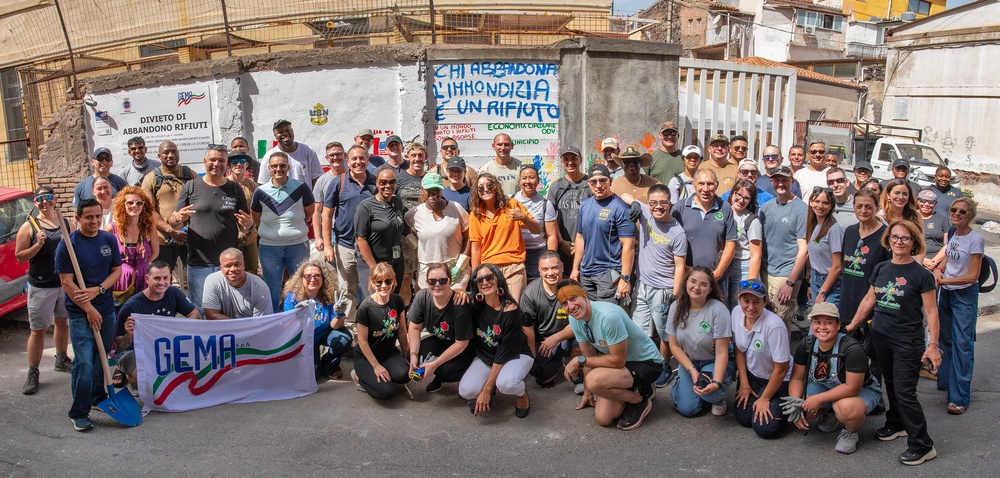 NAS Sigonella Sailors volunteer for a local school clean-up efforts.