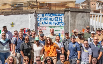 NAS Sigonella Sailors volunteer for a local school clean-up efforts.