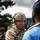 British soldier calms frustrated refugee British soldier calms frustrated refugee