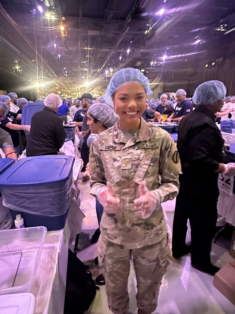 Miss USA, 2Lt. Alma Cooper packs meals for the needy on 9/11