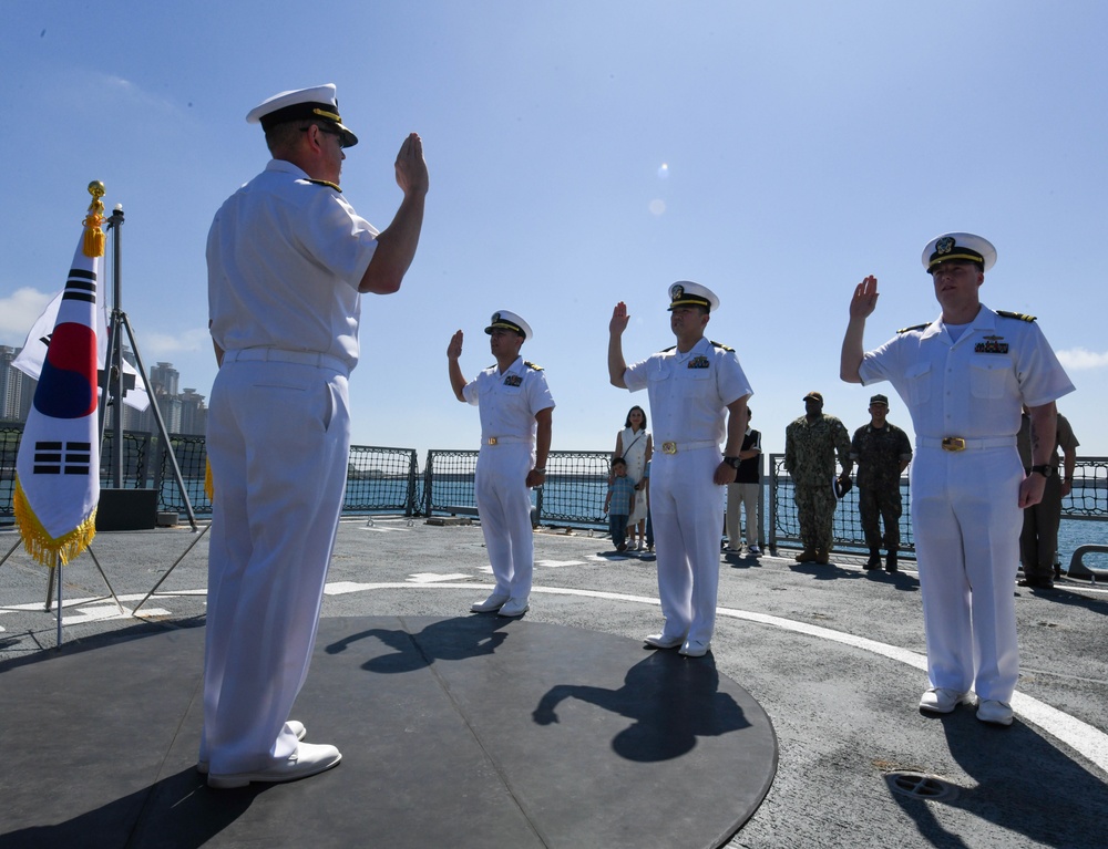 Three U.S. Naval Officers promote during ceremony aboard ROKS Gyeongnam