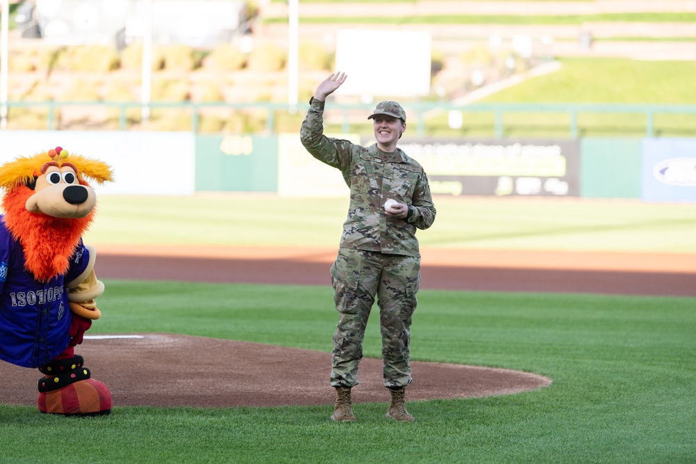 SrA Rachel Heath throws the first pitch at Isotopes baseball game on Sept 11