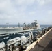 Abraham Lincoln conducts a replenishment-at-sea with USNS Big Horn