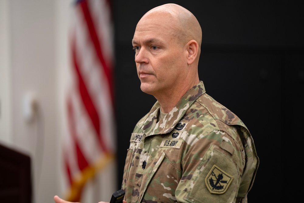 Courtesy Photo | Center for Law and Military Operations Director Lt. Col. Mike Lamphier shares his mental health journey with The Judge Advocate General's Legal Center and School during a recent Health and Holistic Fitness Leader Development Program lecture. (U.S. Army photo by Jason Wilkerson)