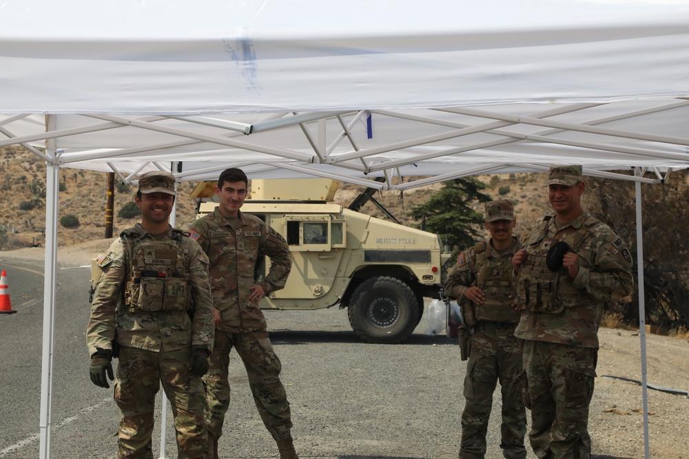 Military and Local Police Secure Evacuation Route