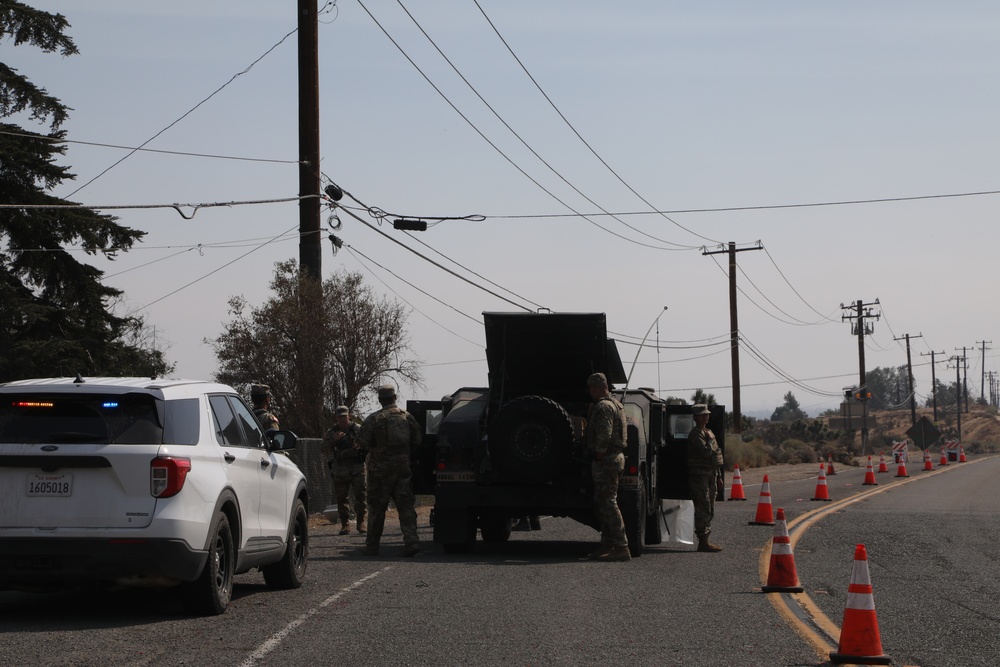National Guard Soldiers Take a Break at Fire Evacuation Post
