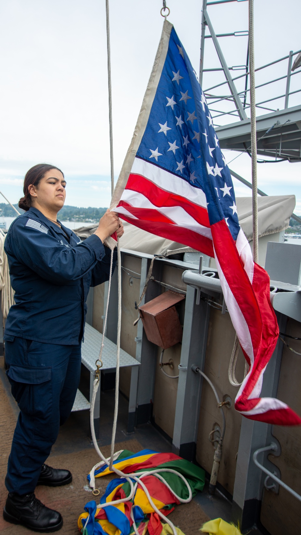 A Nimitz Sailor Raises the Ensign