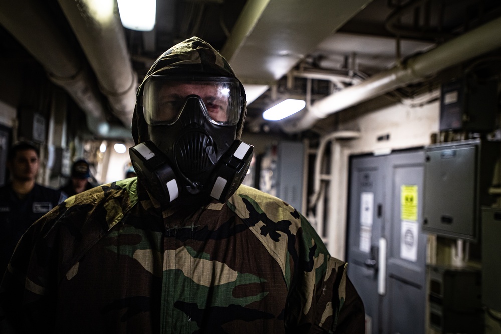 A Nimitz Sailor Dons J-List Gear During Simulation