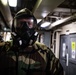 A Nimitz Sailor Dons J-List Gear During Simulation