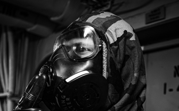 A Nimitz Sailor Dons J-List Gear During Simulation