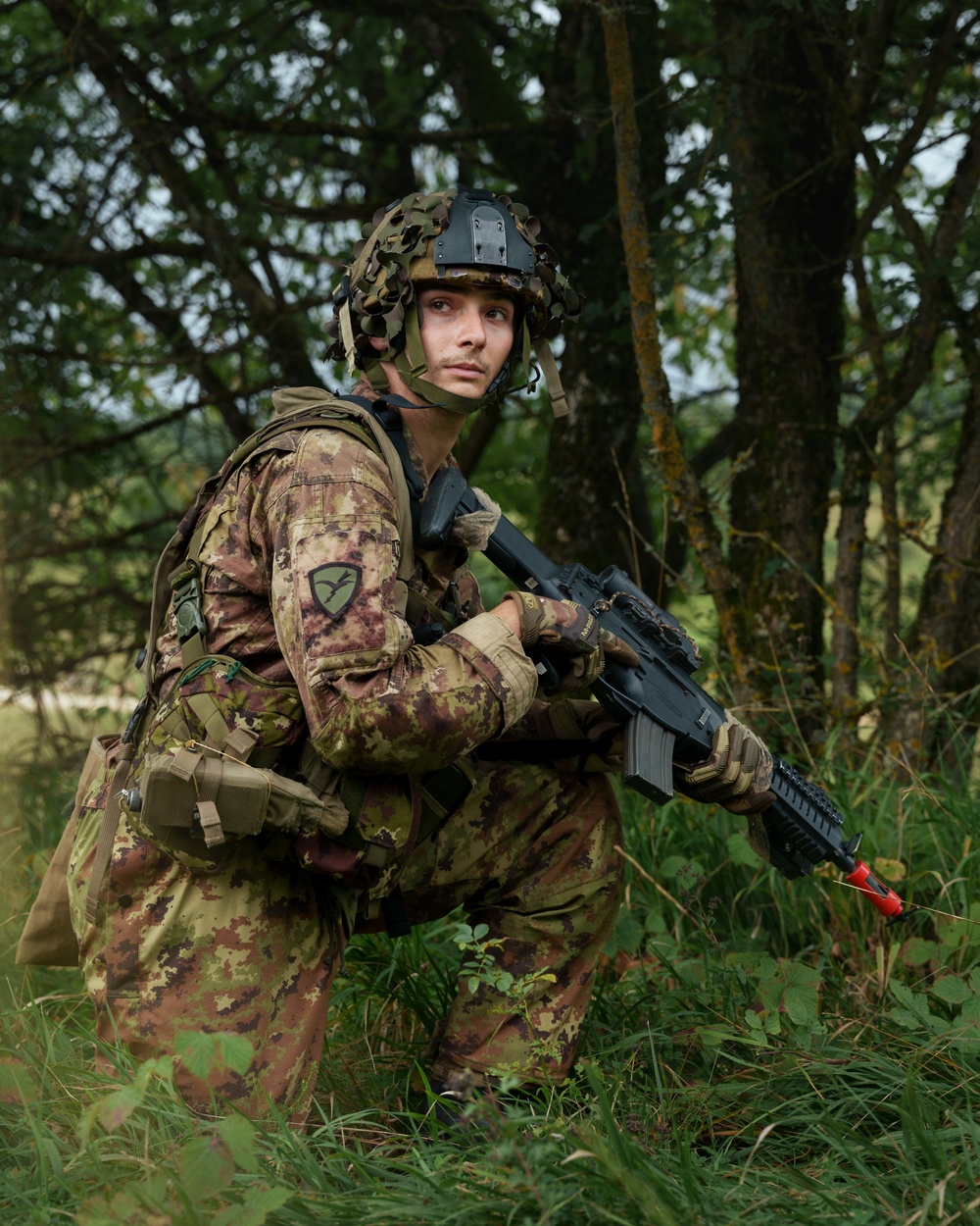 An Italian Paratrooper Takes A Knee During Saber Junction 24