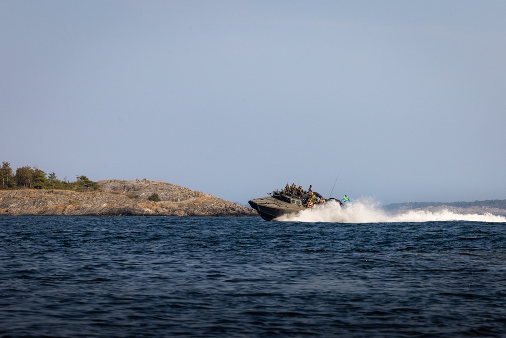 U.S. and Swedish Marines conduct live fire machine gun range from combat boats