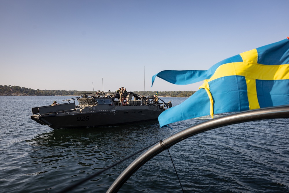 U.S. and Swedish Marines conduct live fire machine gun range from combat boats