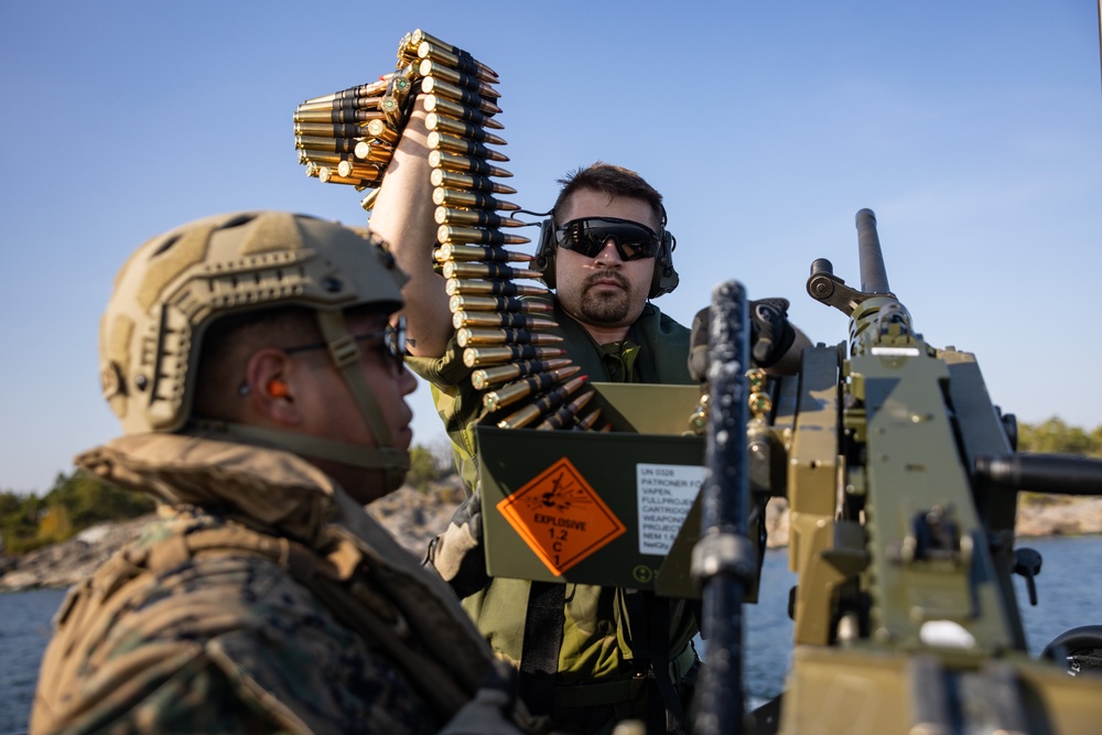 U.S. and Swedish Marines conduct live fire machine gun range from combat boats