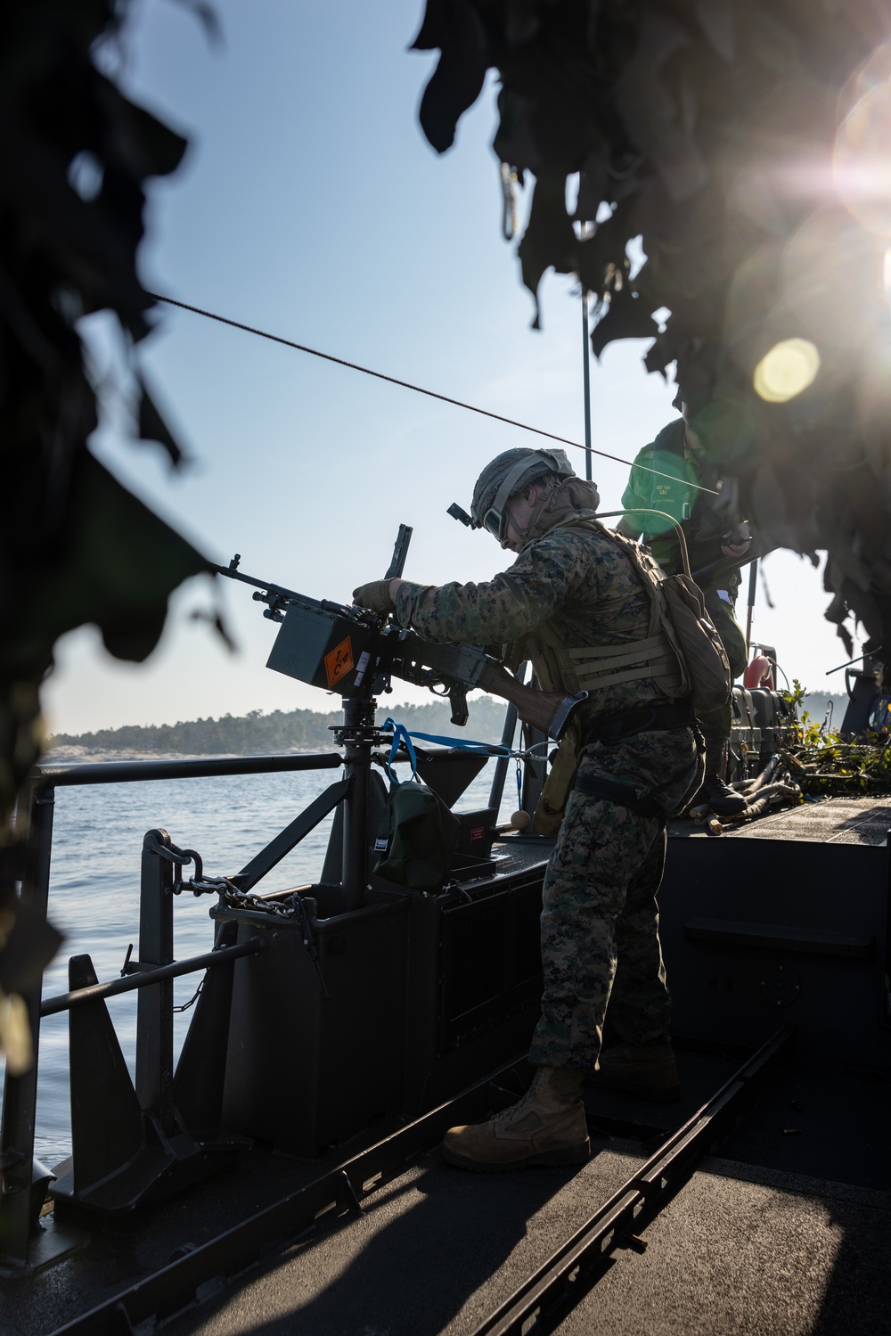 U.S. and Swedish Marines conduct live fire machine gun range from combat boats