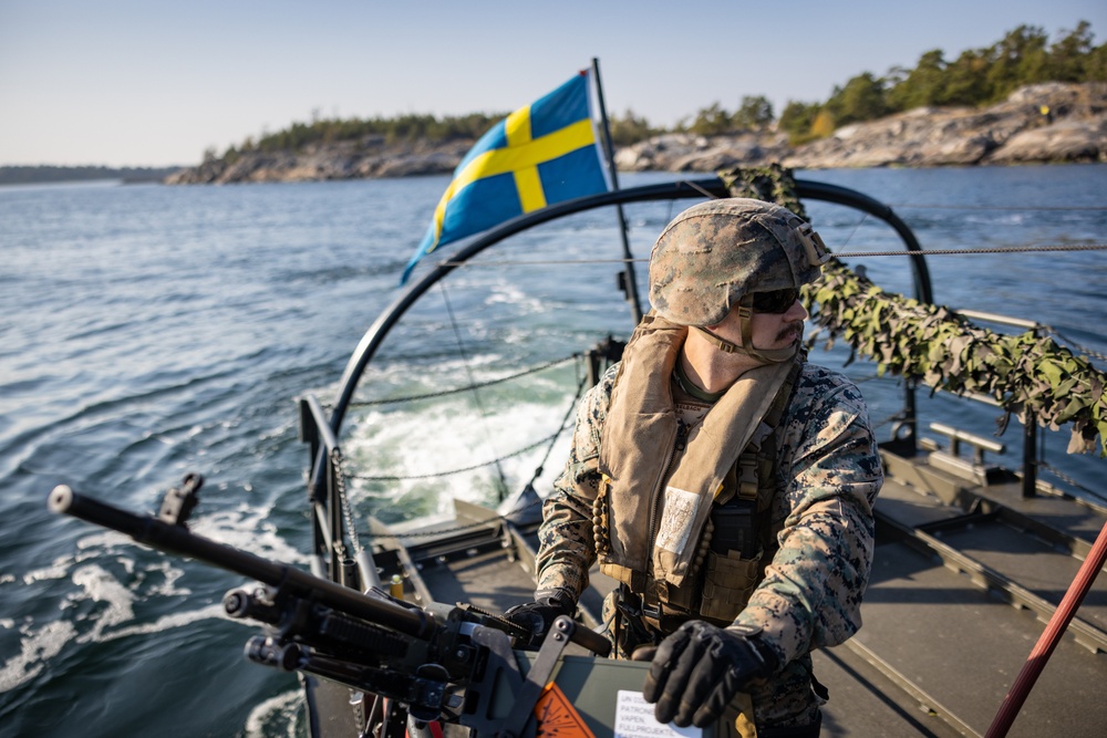 U.S. and Swedish Marines conduct live fire machine gun range from combat boats