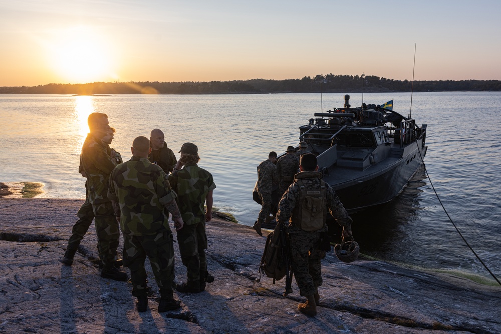 U.S. and Swedish Marines conduct live fire machine gun range from combat boats