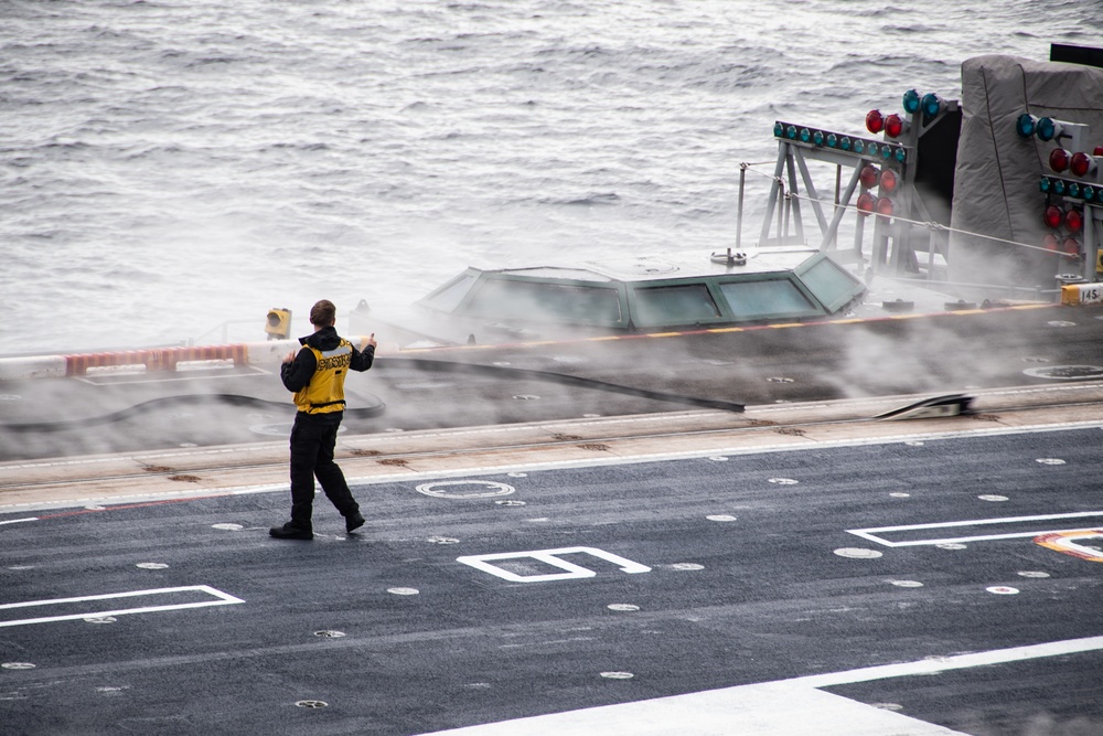 A Nimitz Sailor Supervises Catapult Preparations