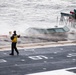 A Nimitz Sailor Supervises Catapult Preparations