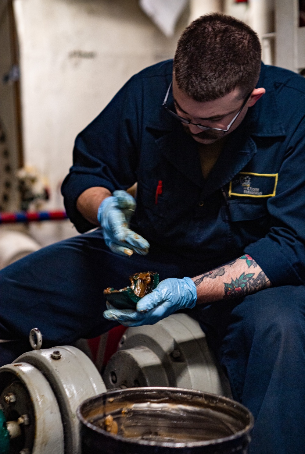 A Nimitz Sailor Conducts Maintenance