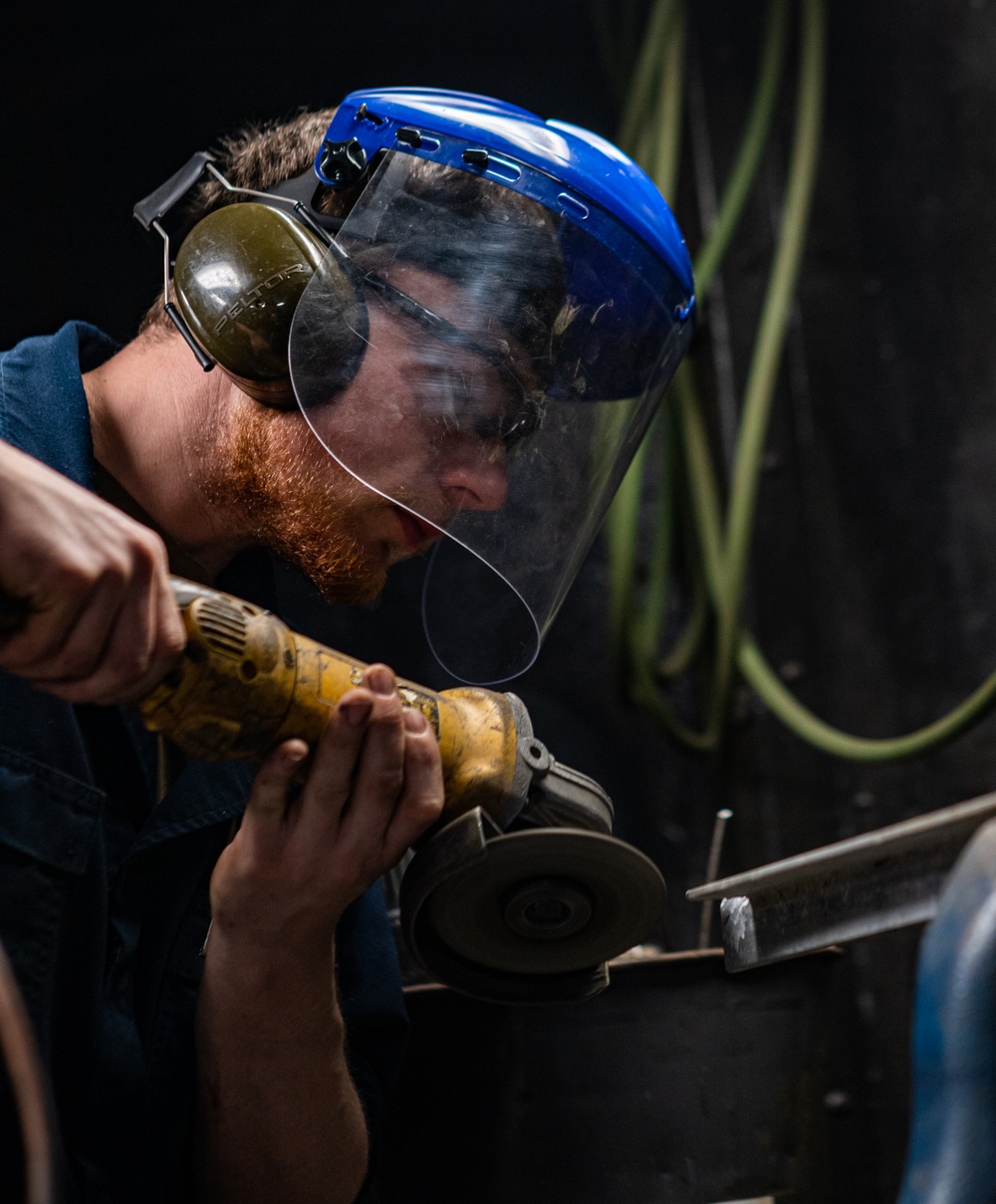 A Nimitz Sailor Grinds Metal