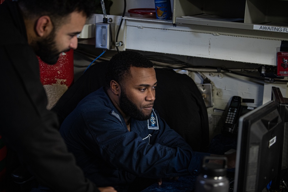 A Nimitz Sailor Gives Administrative Assistance