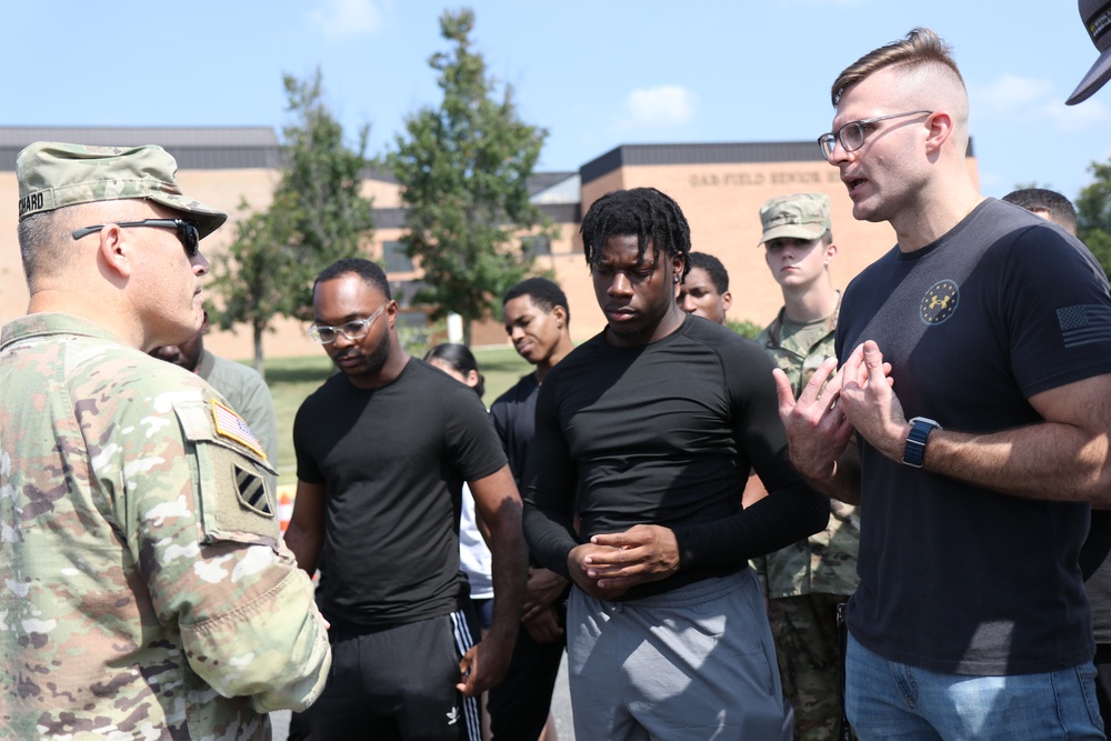 U.S. Army Brig. Gen. Leland L. Blanchard II, speaks with recruits joining the DCNG